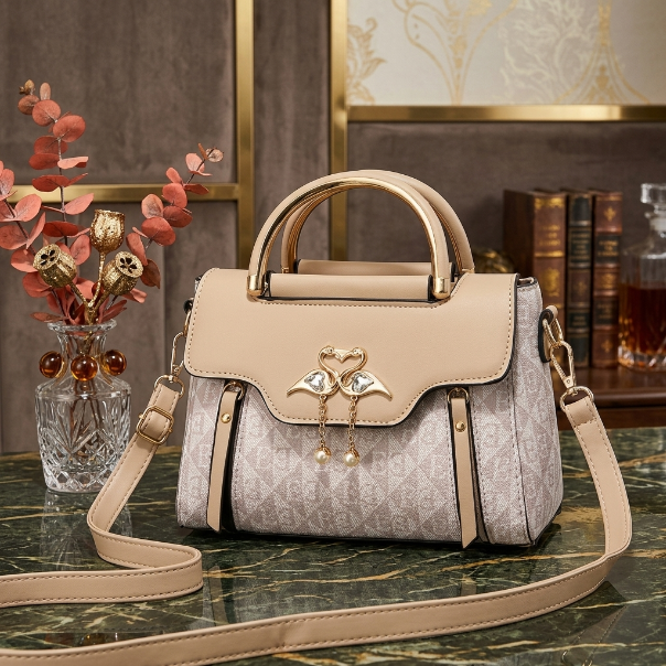 Designer handbag with floral charm on a marble surface with decorative background
