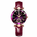 Luxury watch with a maroon leather strap and purple gemstone face on a white background