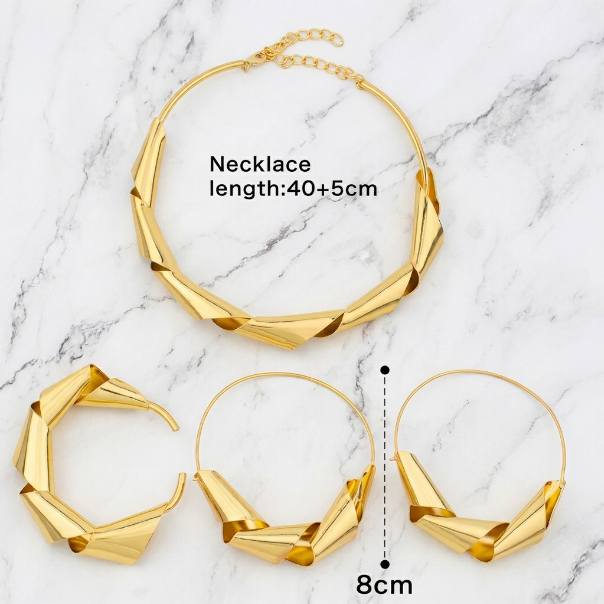 Gold necklace and hoop earrings on a marble background with measurements.