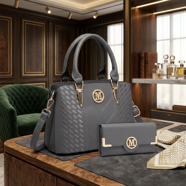 Gray handbag and wallet set on a wooden table with a luxurious interior background