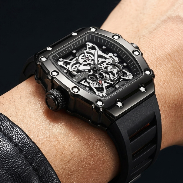 Black skeleton watch on a wrist with a dark background