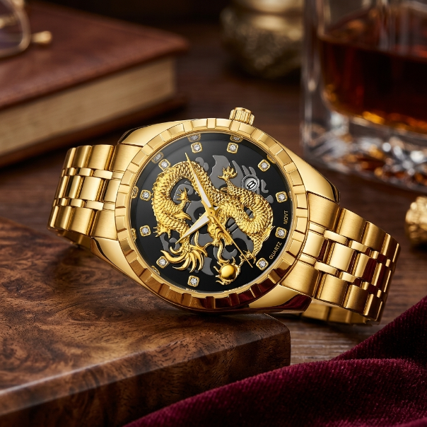 A luxury men's watch with a gold-tone metal bracelet and case, featuring a black dial with a detailed gold dragon motif and skeletonized inner dial. The watch is styled on a dark wooden surface with a glass of whiskey and books in the background.
