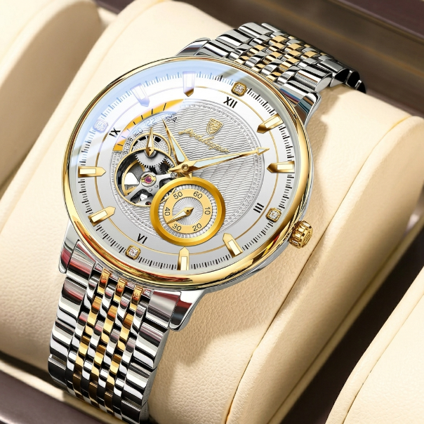 Luxury watch with a silver and gold band on a beige cushion